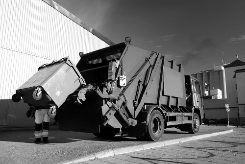 Residents disposing of old furniture in Canarywharf recycling center